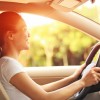 happy-woman-driving-in-her-car-pothole-free